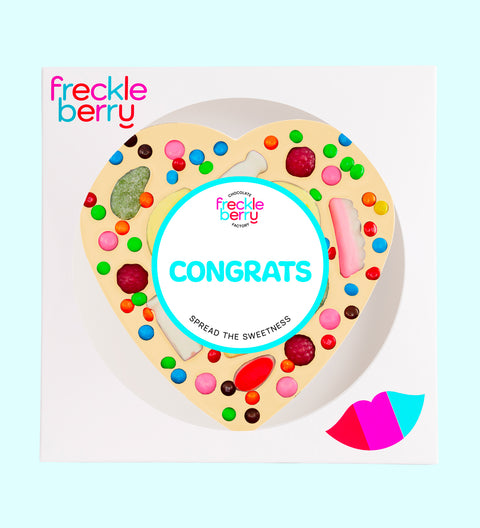 Premium giant Belgian white chocolate heart pizza loaded with colourful lollies with "Congrats" design/label -  the perfect fun and festive way to celebrate achievements.