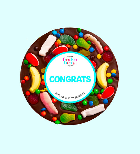 Premium giant Belgian dark chocolate pizza loaded with colourful lollies with "Congrats" design/label -  the perfect fun and festive way to celebrate achievements.