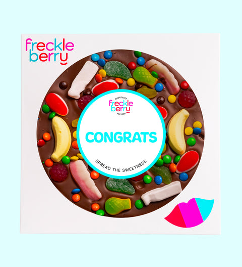 Premium giant Belgian milk chocolate pizza loaded with colourful lollies with "Congrats" design/label -  the perfect fun and festive way to celebrate achievements.