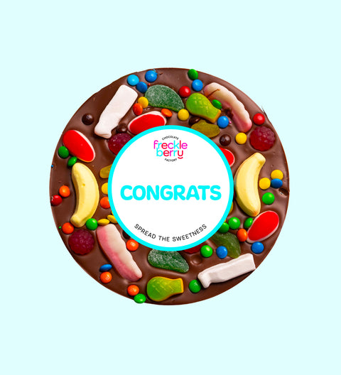 Premium giant Belgian milk chocolate pizza loaded with colourful lollies with "Congrats" design/label -  the perfect fun and festive way to celebrate achievements.