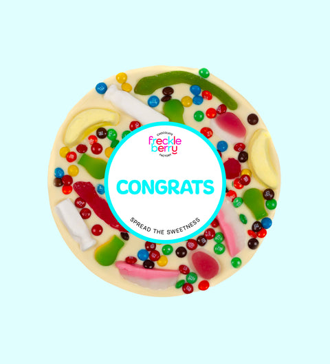 Premium giant Belgian white chocolate pizza loaded with colourful lollies with "Congrats" design/label -  the perfect fun and festive way to celebrate achievements.