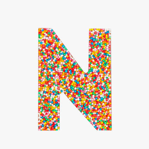 Crafted premium Belgian chocolate letter "N" topped with colourful sprinkles – a fun and tasty treat perfect for personalising any occasion.