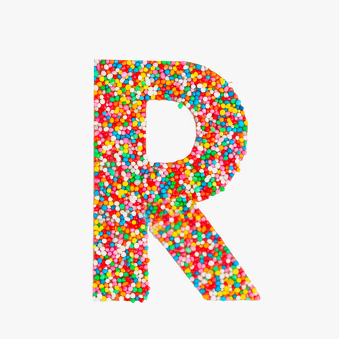 Premium Belgian chocolate letter "R" topped with colourful sprinkles – a fun and tasty treat perfect for personalising any occasion.