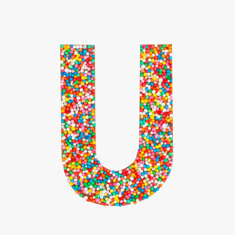 Premium Belgian chocolate letter "U" topped with colourful sprinkles – a fun and tasty treat perfect for personalising any occasion.