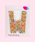 Premium Belgian chocolate letter "W" topped with colourful sprinkles – a fun and tasty treat perfect for personalising any occasion.