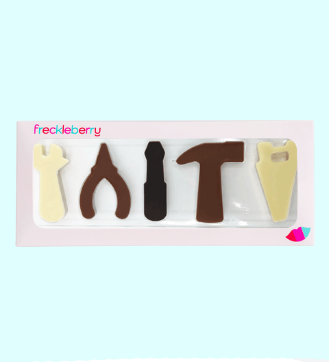 A fun, edible set or collection of Belgian chocolate shaped like carpentry tools, perfect for gifting or creative snacking.