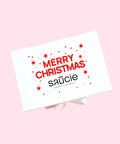 Merry Christmas card with 'saucie' branding on a pink background