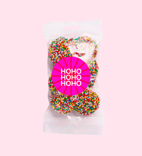 Dark chocolate freckles made from rich premium Belgian dark chocolate and topped with colourful sprinkles with HoHoHo stickers. A festive treat perfect for gifting or sharing.