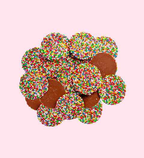 Dark chocolate freckles made from rich premium Belgian dark chocolate and topped with colourful sprinkles. A festive treat perfect for gifting or sharing.