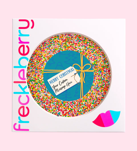Creamy giant Belgian chocolate (available in 3 variants - dark, milk or white) with colourful sprinkles, customised with a festive blue present design for holiday gifting.