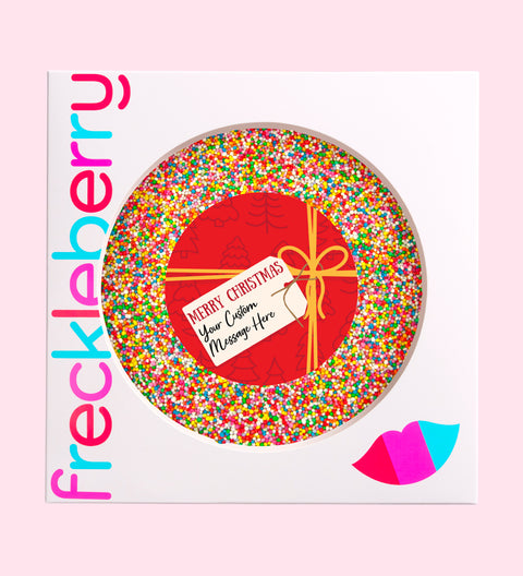 Creamy giant Belgian chocolate (available in 3 variants - dark, milk or white) topped with colourful sprinkles, customised with a festive red present design for holiday gifting.