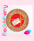 Creamy giant Belgian chocolate (available in 3 variants - dark, milk or white) topped with colourful sprinkles, customised with a festive red present design for holiday gifting.
