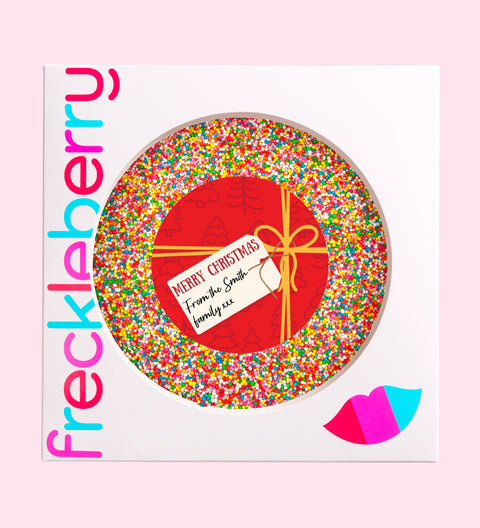 Creamy giant Belgian chocolate (available in 3 variants - dark, milk or white) topped with colourful sprinkles, customised with a festive red present design for holiday gifting.