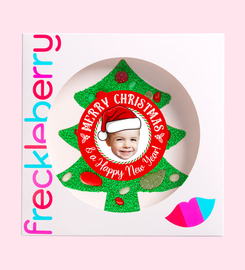 Premium Belgian chocolate tree (available in 3 variants - dark, milk or white) topped with colourful lollies and vibrant green sprinkles, customised with a festive Santa hat design for holiday cheer.