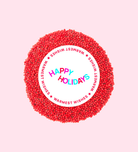 Premium Belgian chocolate topped with bright red sprinkles, wrapped in a festive Happy Holidays design – perfect for gifting.