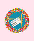 Creamy Belgian chocolate (available in 3 variants - dark, milk or white) topped with colourful sprinkles, customised with a festive blue present design for holiday gifting.