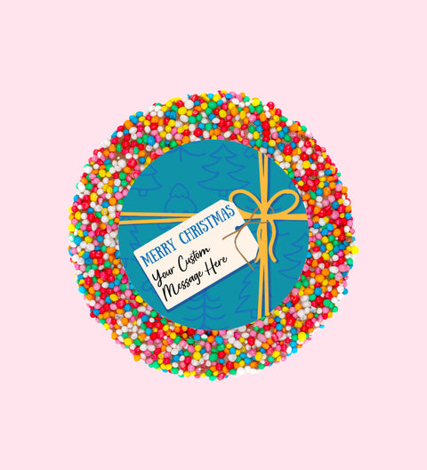 Creamy Belgian chocolate (available in 3 variants - dark, milk or white) topped with colourful sprinkles, customised with a festive blue present design for holiday gifting.