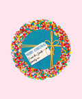 Creamy Belgian chocolate (available in 3 variants - dark, milk or white) topped with colourful sprinkles, customised with a festive blue present design for holiday gifting.