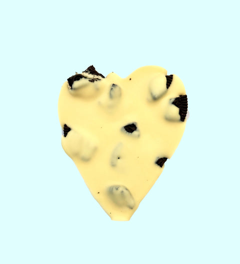 Creamy Belgian white chocolate heart topped with crunchy chocolate cookie pieces for a sweet and indulgent treat.