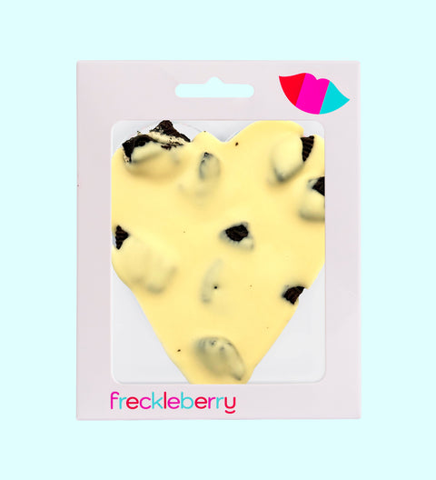 Creamy Belgian white chocolate heart topped with crunchy chocolate cookie pieces for a sweet and indulgent treat.