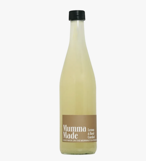 Bottle of 'Mumma Made' lemon basil cordial on a white background