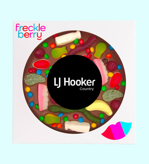 Premium Belgian chocolate pizza (available in 3 variants - dark, milk or white) loaded with lollies, customised with your logo or graphic upload for impactful corporate gifting.