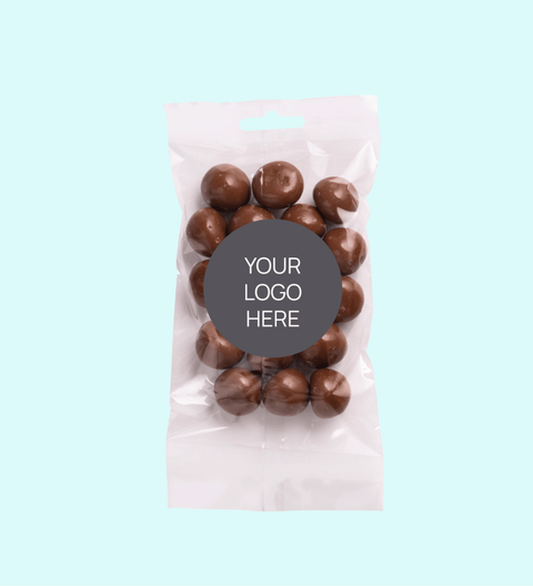 Sweet treat bags filled with delicious milk chocolate coated raspberries and customised with your logo or graphic upload for memorable corporate gifting.