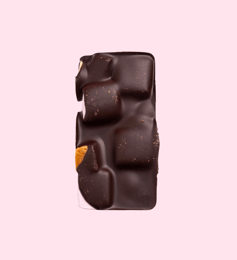 Dark Rocky Road loaded with marshmallows, nuts, and dried fruit, all coated in rich premium Belgian dark chocolate – a decadent and chewy treat.