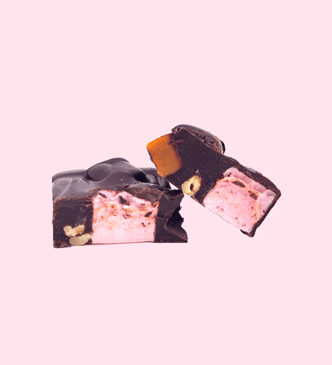 Dark Rocky Road loaded with marshmallows, nuts, and dried fruit, all coated in rich premium Belgian dark chocolate – a decadent and chewy treat.