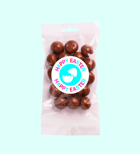 Tangy raspberries covered in smooth premium Belgian milk chocolate with Happy Easter - Broken Egg sticker, a decadent and fruity festive treat.