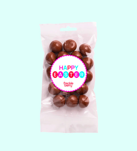 Tangy raspberries covered in smooth premium Belgian milk chocolate with Happy Easter - Circles sticker, a decadent and fruity festive treat.