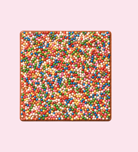 Square block of white chocolate with a geometric pattern premium belgian chocolate with freckles