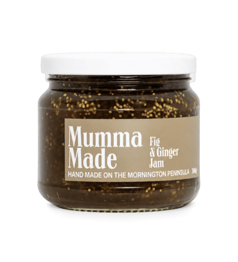 A jar of Mumma Made Fig & Ginger Jam on a clean white background. The product is in a clear glass jar showing the dark brown jam with visible figs and ginger pieces, topped with a white lid and a beige label with white text.