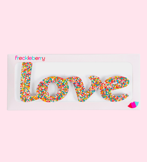 Premium Belgian milk chocolate word "Love" topped with colourful sprinkles – a sweet and heartfelt treat.