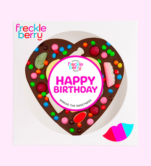 Giant heart-shaped Belgian dark chocolate pizza loaded with colourful lollies, the perfect festive treat to celebrate birthdays.