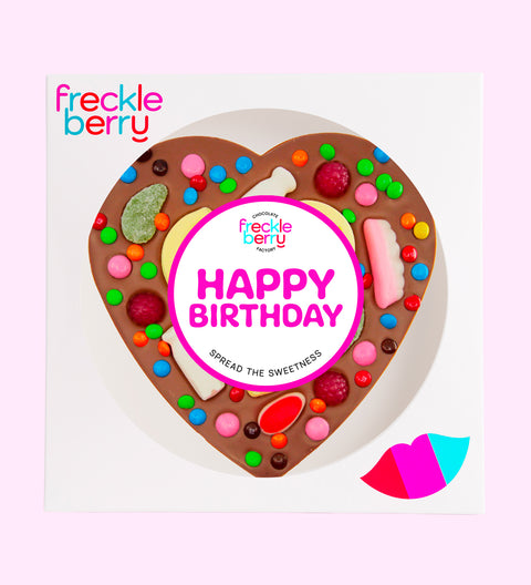Giant heart-shaped Belgian milk chocolate pizza loaded with colourful lollies, the perfect festive treat to celebrate birthdays.