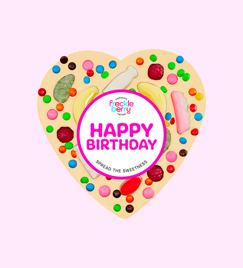 Creamy giant Belgian white chocolate heart pizza  loaded with colourful lollies and festive "Happy Birthday" label/design, the perfect festive treat to celebrate birthdays.