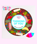 Premium giant Belgian chocolate (available in 3 variants - dark, milk of white) pizza with colourful lollies and M&M®s labeled with "Thinking of You" sticker/design. 