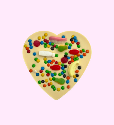Premium Belgian white chocolate giant heart topped with colourful lollies, can be customised for the perfect celebration on any occasion.