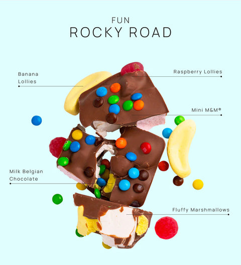 Fun Rocky Road bursting with marshmallows, nuts, and colourful candies, all coated in smooth premium Belgian milk chocolate – a playful and delicious treat.