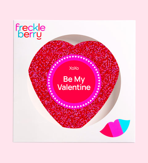 Heart-shaped product with 'Be My Valentine' text on a pink background, featuring the Freckle Berry brand.
