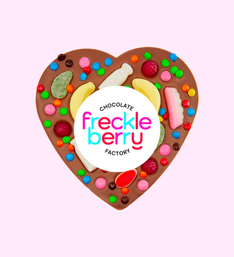 Belgian milk chocolate heart pizza loaded with colourful lollies, perfect for sharing, gifting, or celebrating any occasion.