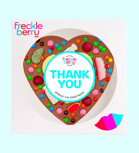 Creamy giant Belgian milk chocolate heart pizza  loaded with colourful lollies with "Thank You" label/design, a fun and sweet way to say thanks.