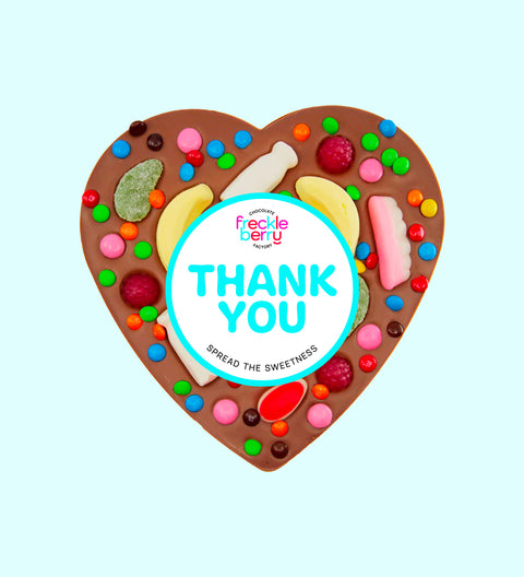 Creamy giant Belgian milk chocolate heart pizza  loaded with colourful lollies with "Thank You" label/design, a fun and sweet way to say thanks.