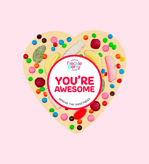 Premium Belgian white chocolate heart pizza loaded with colourful lollies with "You're Awesome" design/label, a fun and sweet way to celebrate someone special.