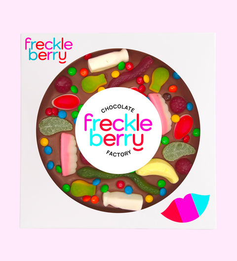 Belgian milk chocolate pizza loaded with colourful lollies, perfect for sharing, gifting, or celebrating any occasion.
