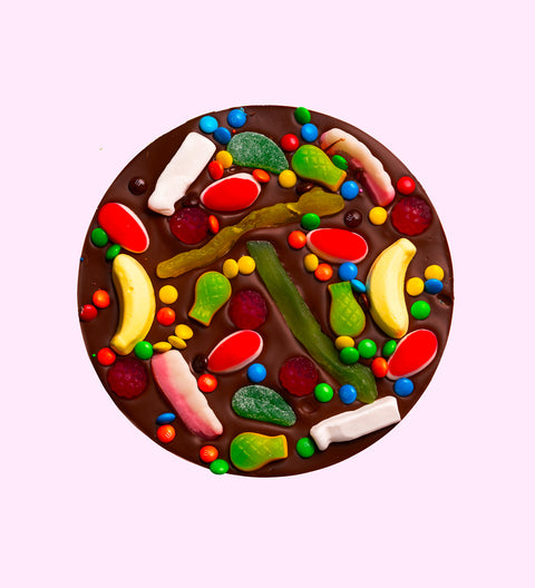 Premium Belgian dark chocolate pizza loaded with colourful lollies, perfect for sharing, gifting, or celebrating any occasion.