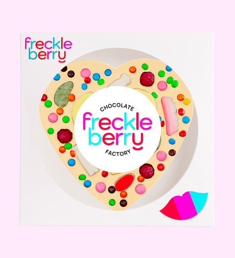 Premium Belgian white chocolate heart pizza loaded with colourful lollies, perfect for sharing, gifting, or celebrating any occasion.