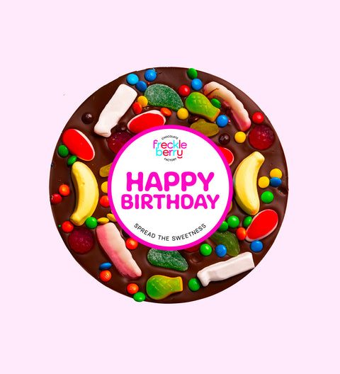 Giant Belgian dark chocolate pizza loaded with colourful lollies, the perfect festive treat to celebrate birthdays.