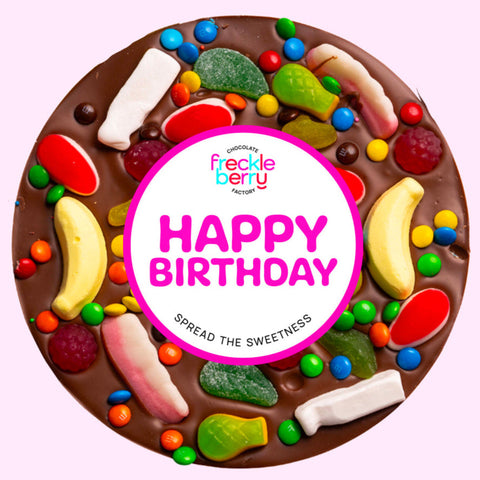 Giant Belgian milk chocolate pizza loaded with colourful lollies, the perfect festive treat to celebrate birthdays.